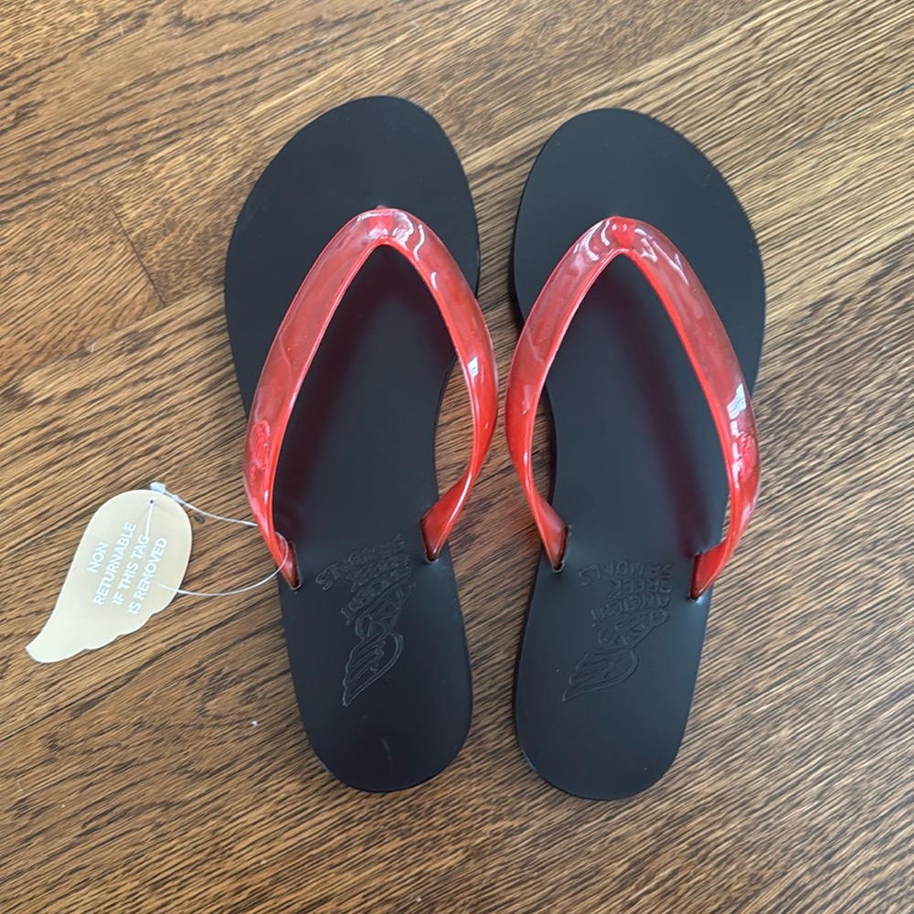 Red jelly flip flops, brand new, a touch too small for me.